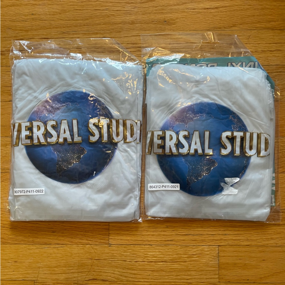 Universal Studios  NIP Hooded Vinyl Rain Poncho Adult  and Child